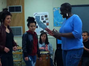 Mabiba Baegne and students at Samuel L. Gompers HS
